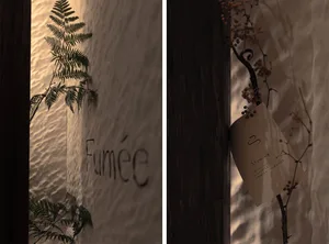 Textured wall featuring the word 'Fumée' and other decorative elements.