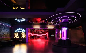 Modern nightclub interior with metallic elements and vibrant lighting