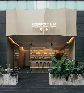 Minimalistic restaurant bar with concrete walls and floors.
