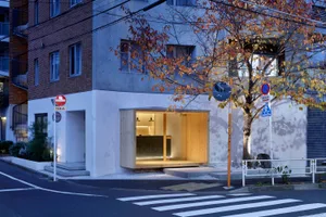 A modern street-side boutique with a wooden and glass facade.