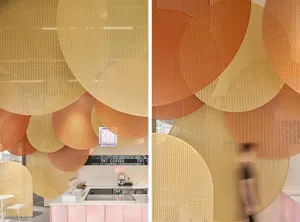Modern interior design featuring metallic perforated spheres