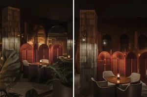 Industrial-themed restaurant interior with red metallic screens and dim lighting
