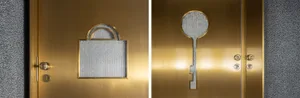 Metal door with a lock and a key-shaped design cutout