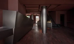 Modern entrance hallway featuring metallic steel elements and minimalist design