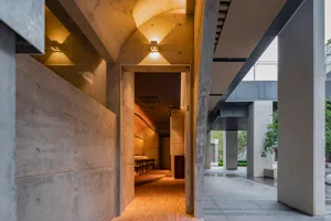 An image showcasing the design of a modern commercial interior with concrete materials.