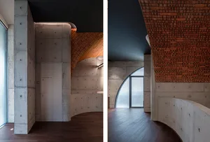 A modern interior space with concrete walls and curved architectural elements.