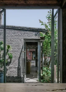 A rustic, industrial-style building with brick walls and an open, airy interior.