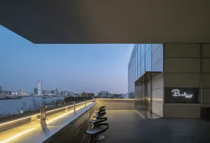 A sleek, modern bar with metallic finishes and a minimalist design.