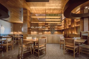 Modern restaurant interior designed with wooden materials and minimalist design