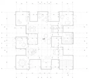 Floor plan of a residential building with various rooms and dimensions labeled.