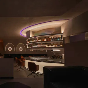 Industrial-style bar interior featuring concrete and glass materials.