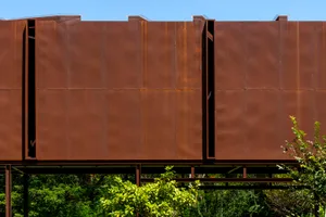 A modern exterior building facade made of corten steel.
