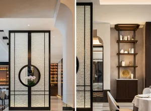 Modern restaurant interior with a glass partition and sleek white seating.