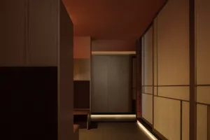 A corridor interior featuring wooden walls and fabric partitions illuminated by soft lighting.