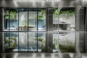 Modern residential architecture featuring metallic, glass, and concrete materials.