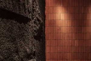 A modern interior featuring textured brick walls.