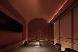 An industrial-style interior space featuring concrete panels and wooden seats.