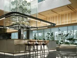 Minimalist coffee shop interior with glass fixtures.
