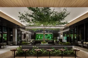 Modern coffee shop interior with indoor plants, wooden counters, and seating.