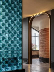A modern interior with glass walls and arches.