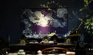 Modern restaurant interior with black glass and lighting fixtures