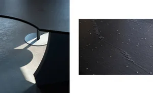Modern minimalist interior design featuring a concrete flooring surface.