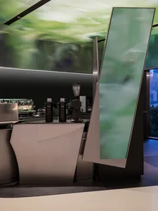 A modern coffee shop counter featuring retro mirrors and metal materials.