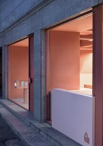 Modern retail stall with glass storefront.