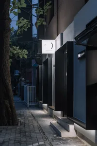 A modern storefront with a concrete exterior.
