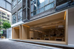 Interior of a modern coffee shop with wooden materials and a minimalist design.