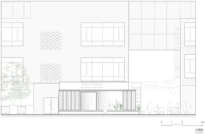 A modern storefront with large windows and brick facade.