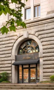 A stone archway entrance to a commercial building.