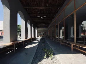 Modern patio with concrete floor and wooden benches