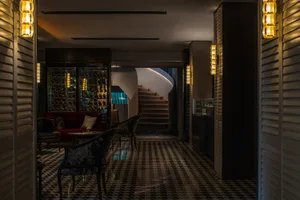 Modern hotel lobby featuring glass, wood, and metal materials