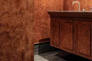 Modern bathroom with wooden paneling and a dark floor.