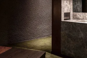 A minimalist mid-century interior featuring marble materials.