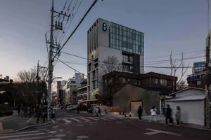 A modern building with concrete and glass exterior features urban architecture design.