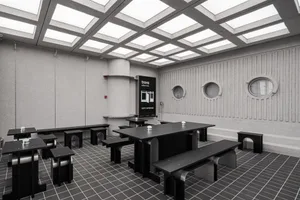A modern office space featuring metal furniture.