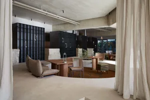 Modern restaurant interior with concrete and wooden elements.