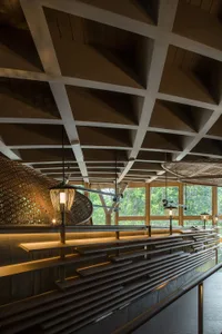 A modern restaurant interior featuring wooden elements.