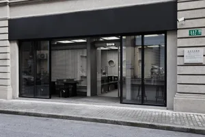 Modern storefront with large glass windows and a minimalist design.
