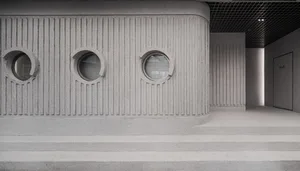 Concrete storefront with large, round windows