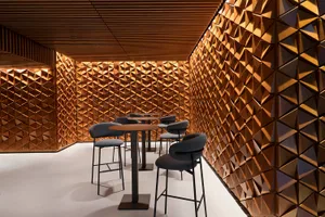 Modern restaurant interior with wooden decor and high-top seating