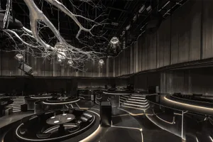 Modern industrial design restaurant with metallic, glass, and wooden decor
