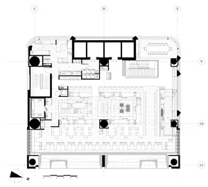 A technical 2D drawing of a modern restaurant designed with concrete materials, showing the layout of the kitchen, dining are