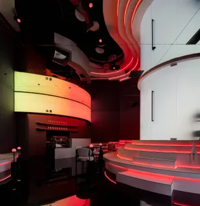 Modern cafe interior with red neon lights and acrylic elements
