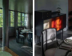 A modern dining room with glass and wooden elements.
