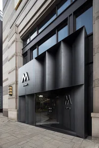 Modern exterior of a commercial building with a metal and glass facade.