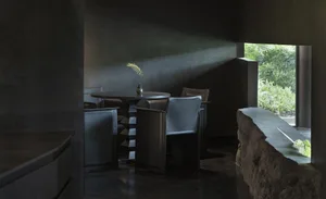 Modern restaurant interior featuring concrete and glass materials