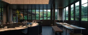 Modern restaurant interior with large windows and wooden furniture.